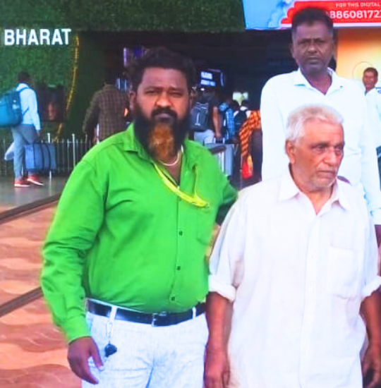 Dasari Jacob with aged person in railway station